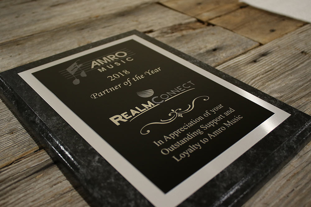 AMRO Music 2018 Partner of the Year plaque awarded to RealmConnect.