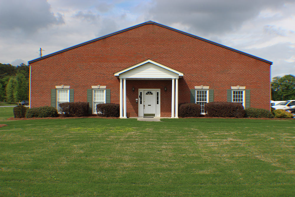 Exterior of red brick building, RealmConnect office.